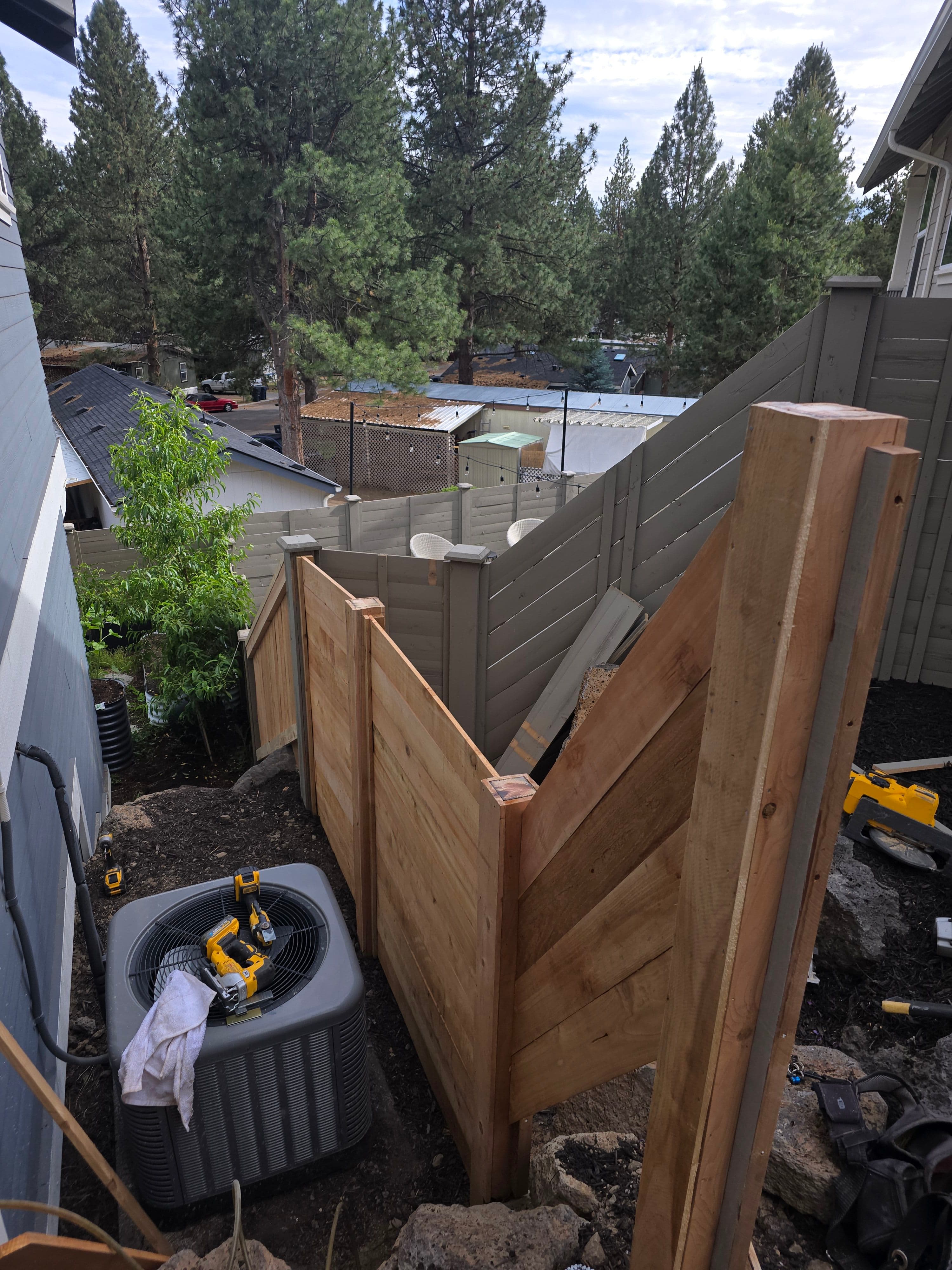 Project Custom 5-Foot Cedar Fence Built Up a Rocky Hillside image